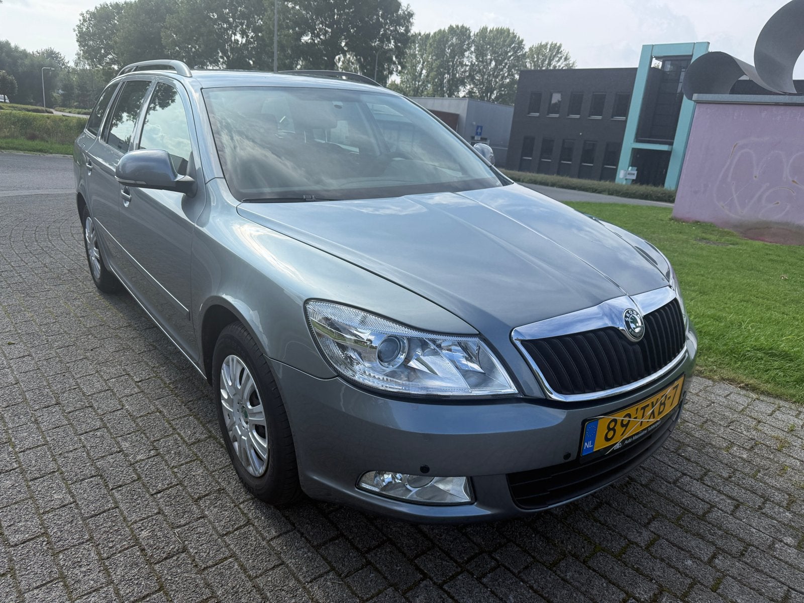 Skoda Octavia 1.2 TSI Combi 2012 Grijs, Auto's, Voorwielaandrijving, 4 cilinders, Origineel Nederlands, Zilver of Grijs