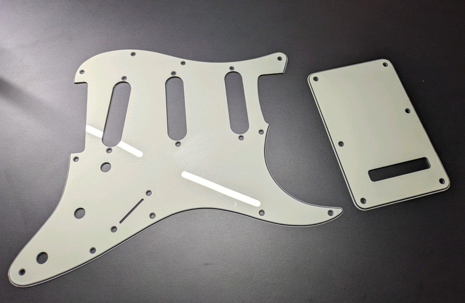 Stratocaster pickguard and back plate