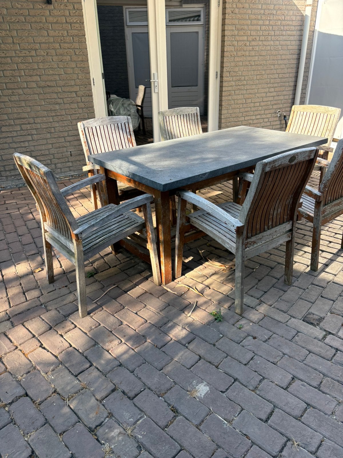 Natuursteen Basalt tafel met 6 stoelen teak, Ophalen, Gebruikt, 6 zitplaatsen, Teakhout