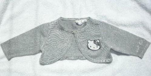 Hello Kitty kort zilverkleurig vestje, maat 62 (qwe), Ophalen of Verzenden, Zo goed als nieuw, Hello Kitty, Truitje of Vestje