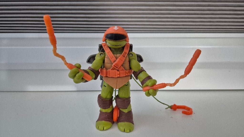Teenage Mutant Ninja Turtle Michelangelo-figuur + wapens, Ophalen of Verzenden