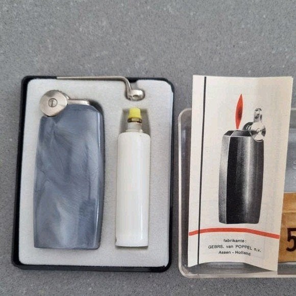 Vintage Poppell aansteker met vulling en vuursteentjes, Gebruikt, Poppell, Ophalen of Verzenden, Onbekend