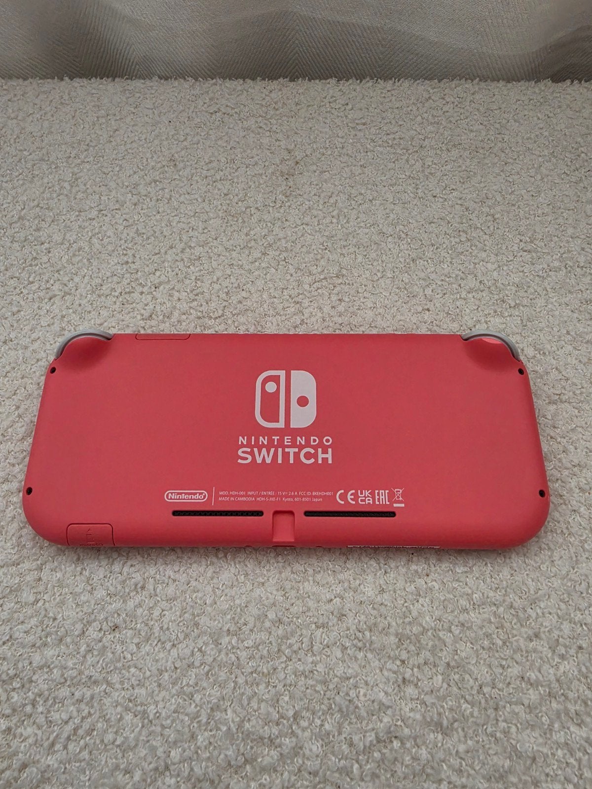 Nintendo Switch Lite Coral + games, Ophalen of Verzenden, Roze of Coral, Zo goed als nieuw