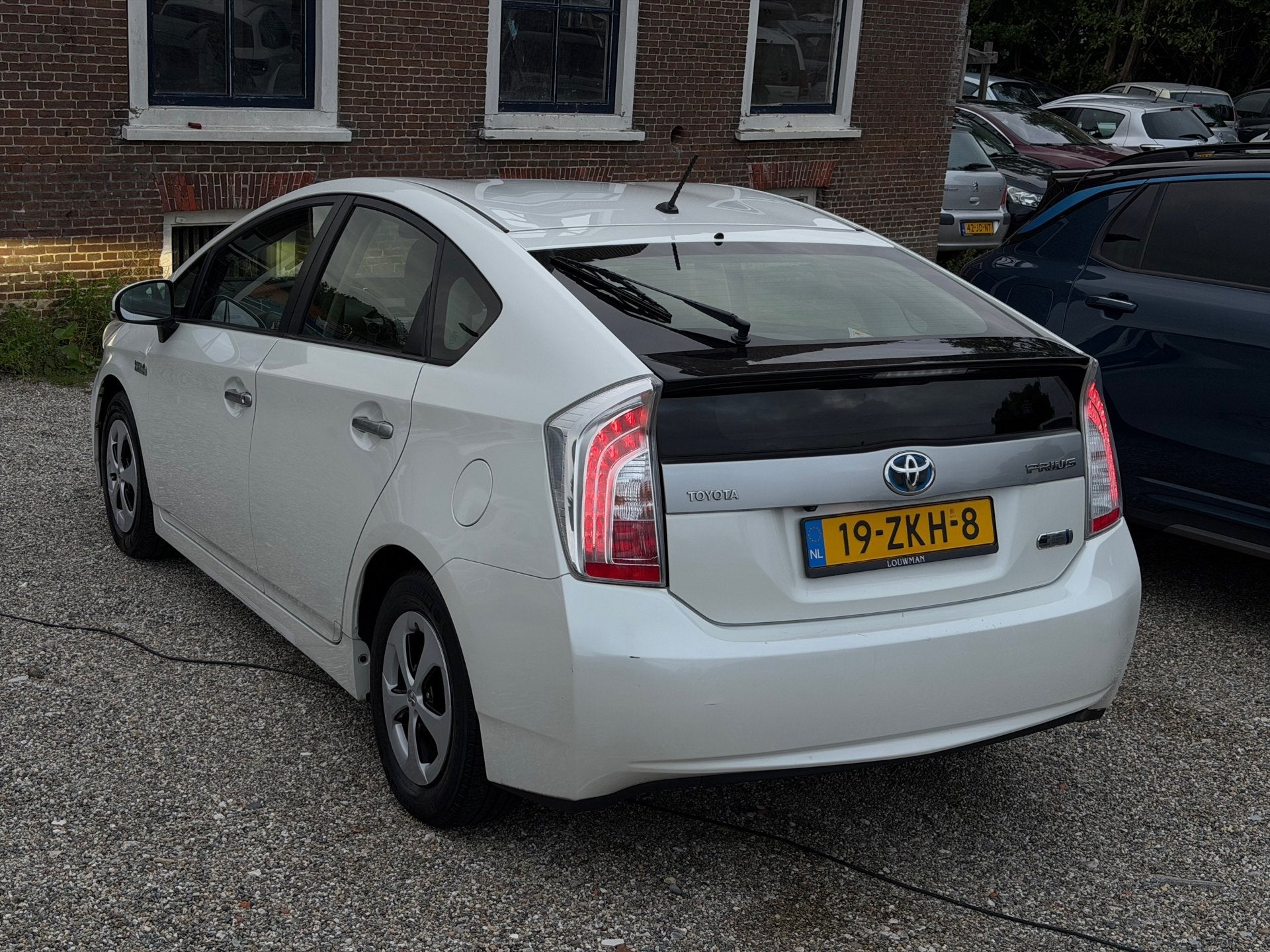 Toyota Prius 1.8 Plug-in Dynamic Business 2e Eig Oplaadbaar, Auto's, Euro 5, Gebruikt, Zwart, Wit