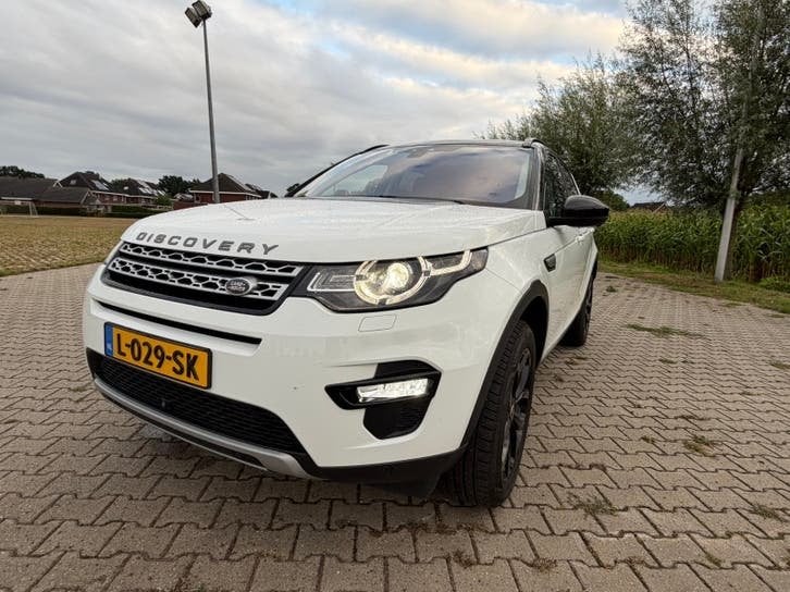 Land Rover Discovery Sport 2.2 SD4 4WD Aut9 2015 Wit, Auto's, Automaat, Dealer onderhouden, Zwart, Wit