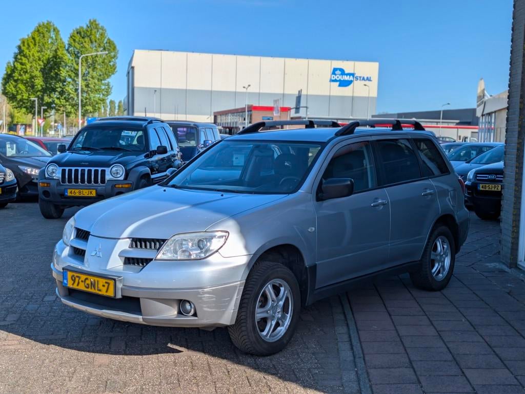 Mitsubishi Outlander Sport 2.0 Travel - Airco - Trekhaak - A, Auto's, Mitsubishi, Voorwielaandrijving, Zwart, 4 cilinders, 1415 kg