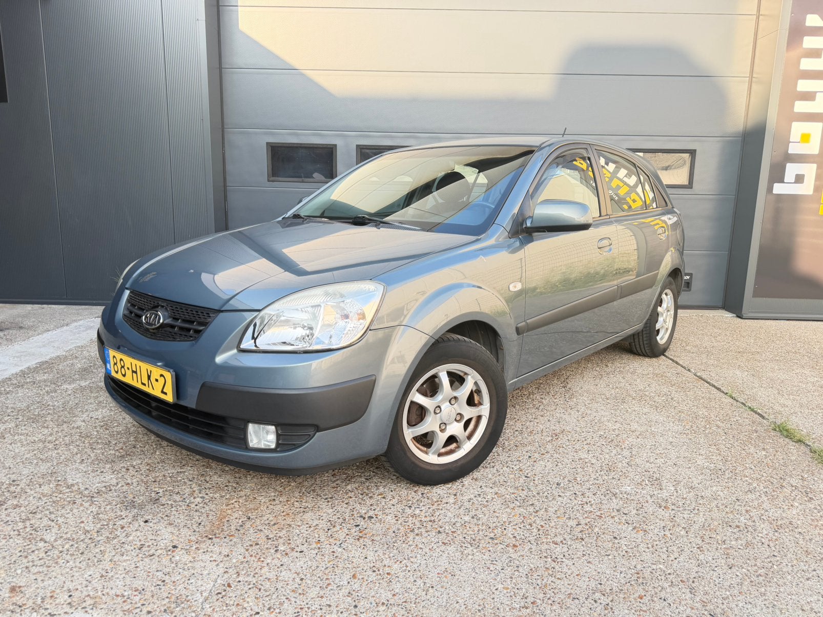 Kia Rio 1.4 X-pect 71KW 2009 5Drs Grijs Airco Apk Nap, Auto's, Kia, Voorwielaandrijving, Stof, 4 cilinders, 1054 kg