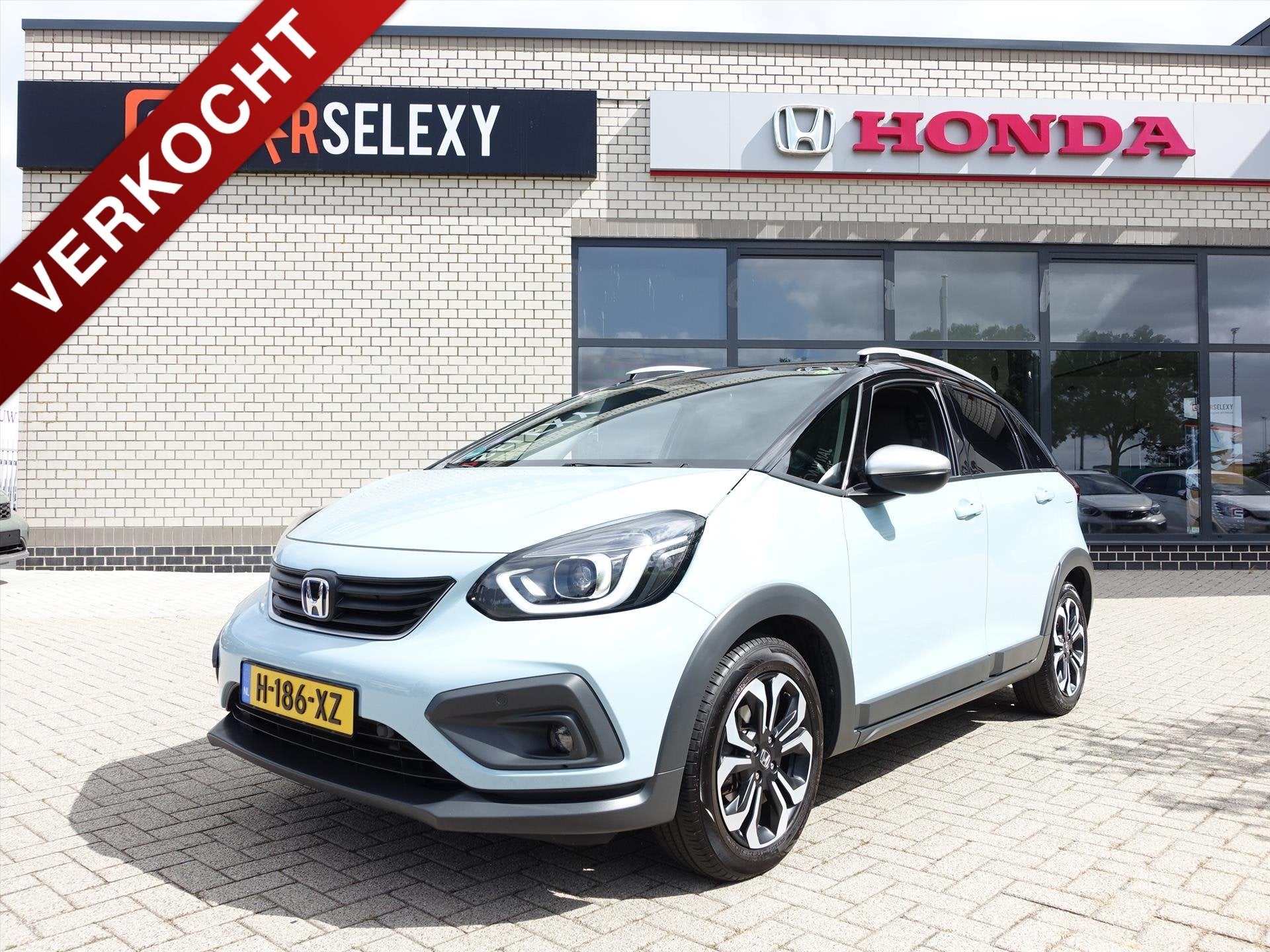 HONDA Jazz 1.5 i-MMD 109pk Hybrid CVT Crosstar Zwart Dak en, Auto's, Honda, Stof, 4 cilinders, Blauw, Bedrijf