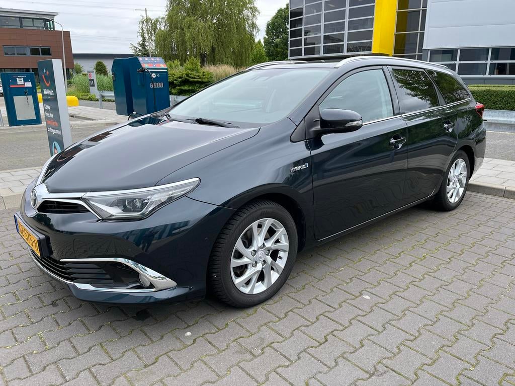 Toyota Auris 1.8 Hybrid Touring Sports CVT 2015 Grijs, Auto's, Toyota, 345 kg, Origineel Nederlands, 81 pk, Zilver of Grijs