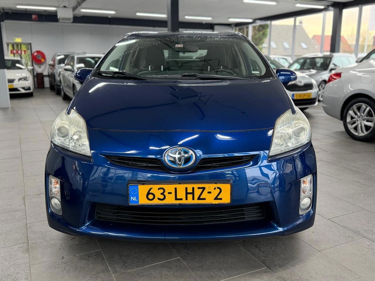 Toyota Prius 1.8 Aspiration 1-eigenaar clima cruise control, Auto's, Stof, Gebruikt, 4 cilinders, Blauw