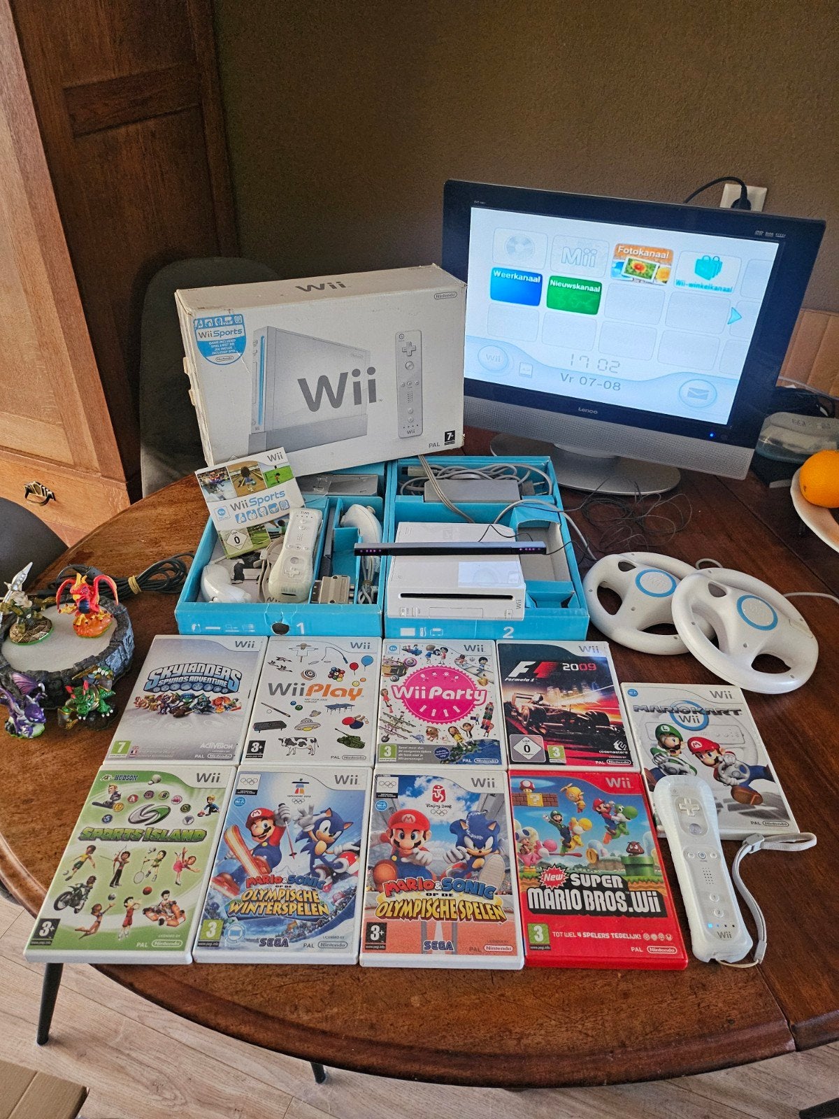 Nintendo Wii Sports editie (cib) met 10 games en extra's., Ophalen of Verzenden, Zo goed als nieuw, Met 2 controllers, Met stuurtje