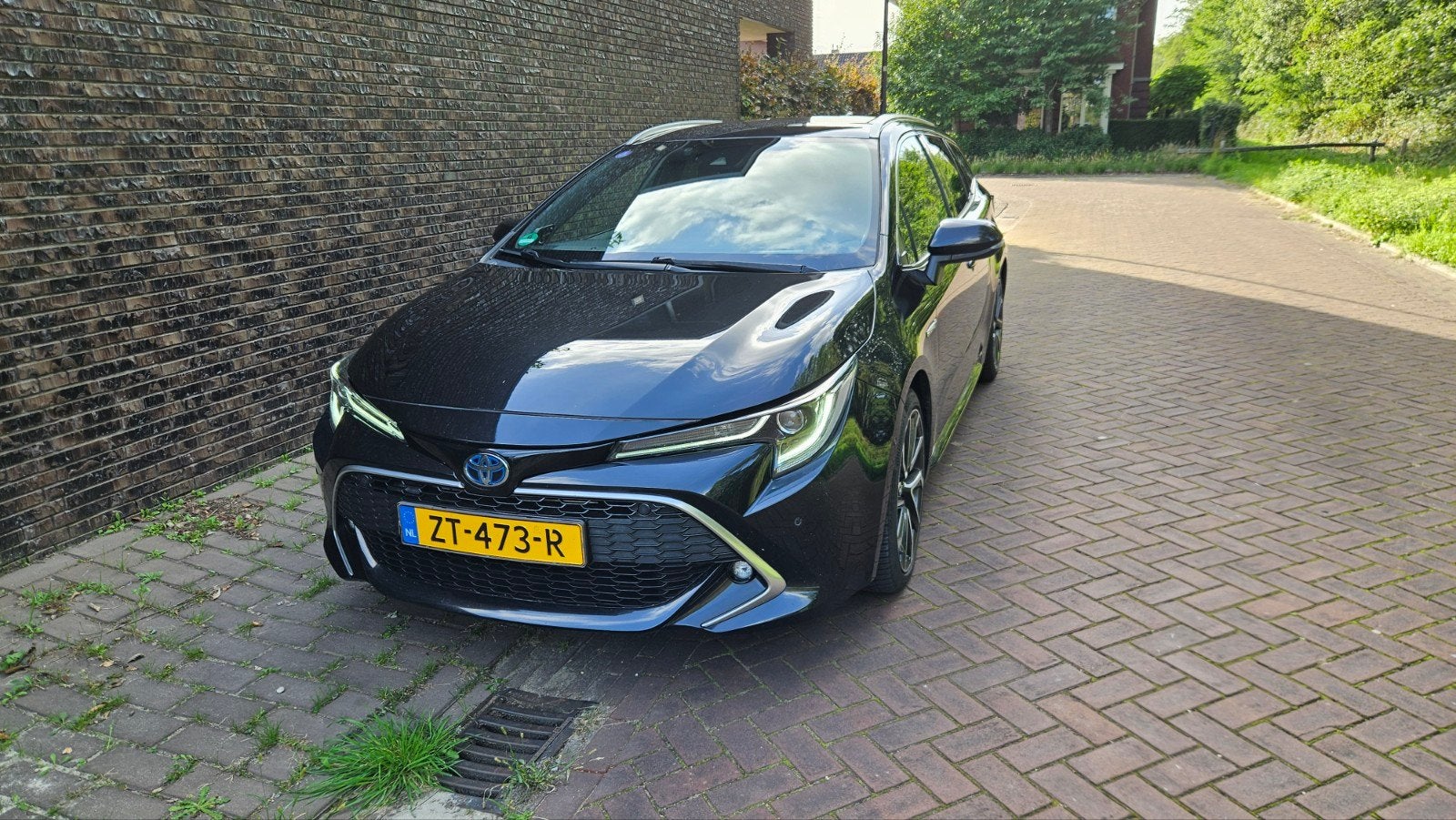 Toyota Corolla TS 2.0 Hybrid 184pk CVT 2019 Zwart, 1345 kg, 450 kg, Leder en Stof, Zwart