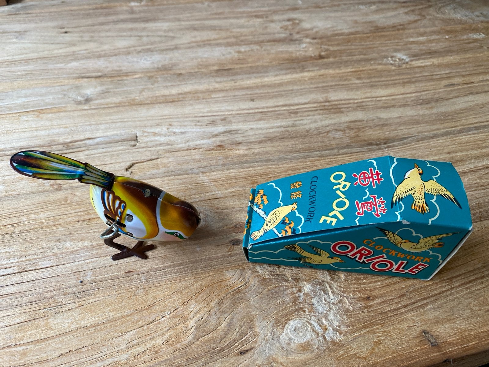 Antiek blikken opwind vogeltje - Nieuwstaat met verpakking, Ophalen of Verzenden