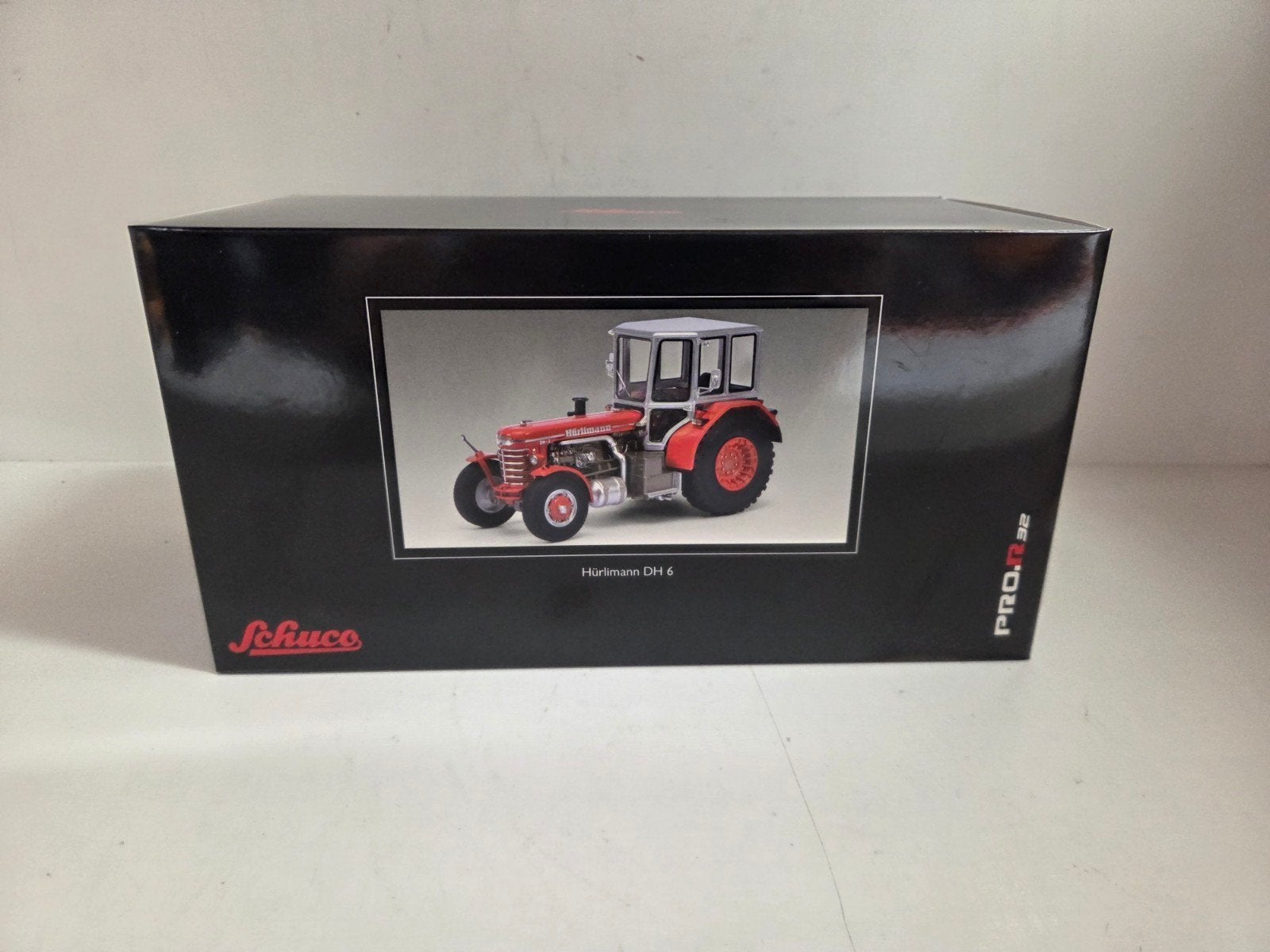 Schuco Hürlimann DH6 1:32, Hobby en Vrije tijd, Modelauto's | 1:32, ., Tractor of Landbouw, Nieuw, Ophalen of Verzenden