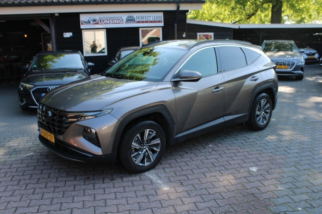 Hyundai TUCSON 1.6 T-GDI HEV Comfort Smart - camera stoelver, Auto's, 4 cilinders, Bruin, USB, 1650 kg