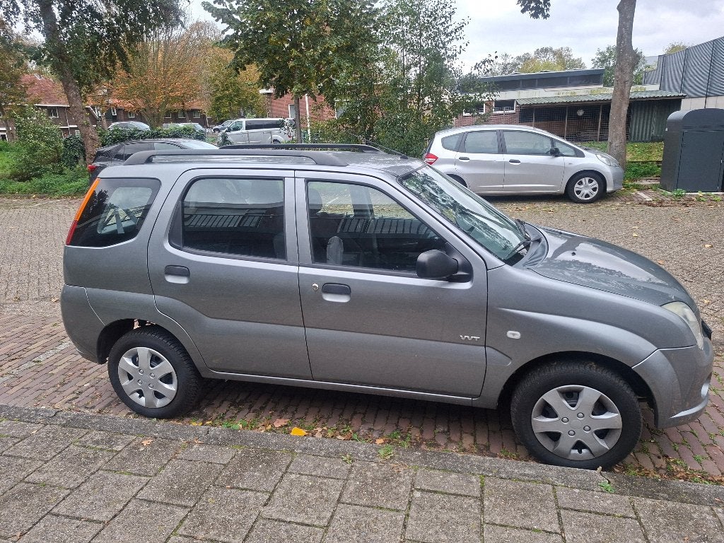 Suzuki Ignis 1.5 5D AUT 2005 Grijs, Auto's, Dealer onderhouden, Stof, Elektrische ramen, 31 €/maand