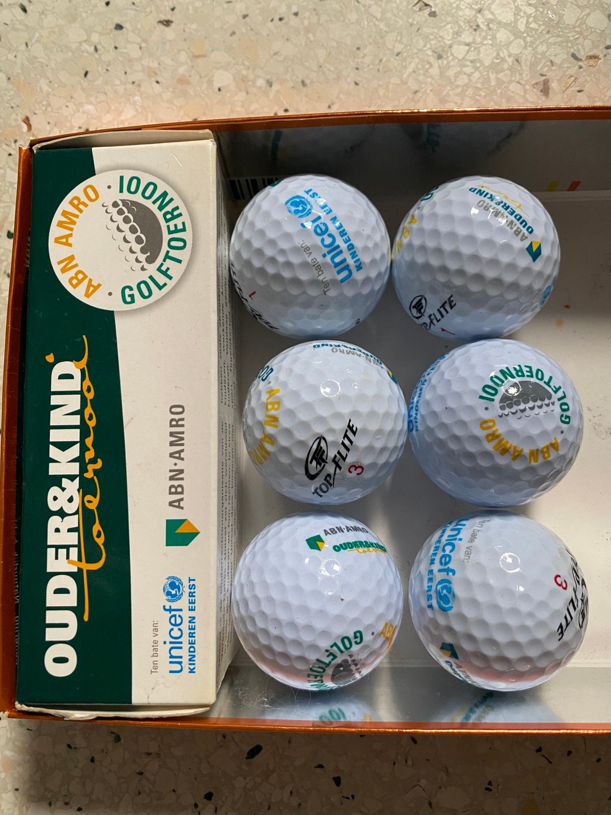 9 nieuwe Top Flite golfballen met logos van AbnAmro unicef, Verzenden, Nieuw, Bal(len)