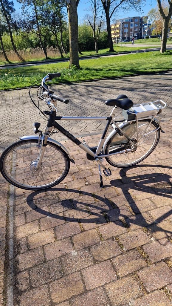 Merk Cross elektrische  herenfiets (met een klein Defect), 51 tot 55 cm, Ophalen, Gebruikt, Overige merken