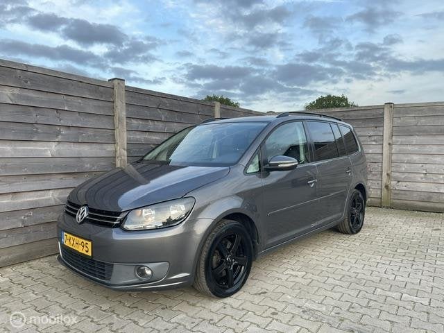 Volkswagen Touran 1.6 TDI Highline BlueMotion 7Persoons, Auto's, Voorwielaandrijving, Euro 5, Stof, Gebruikt