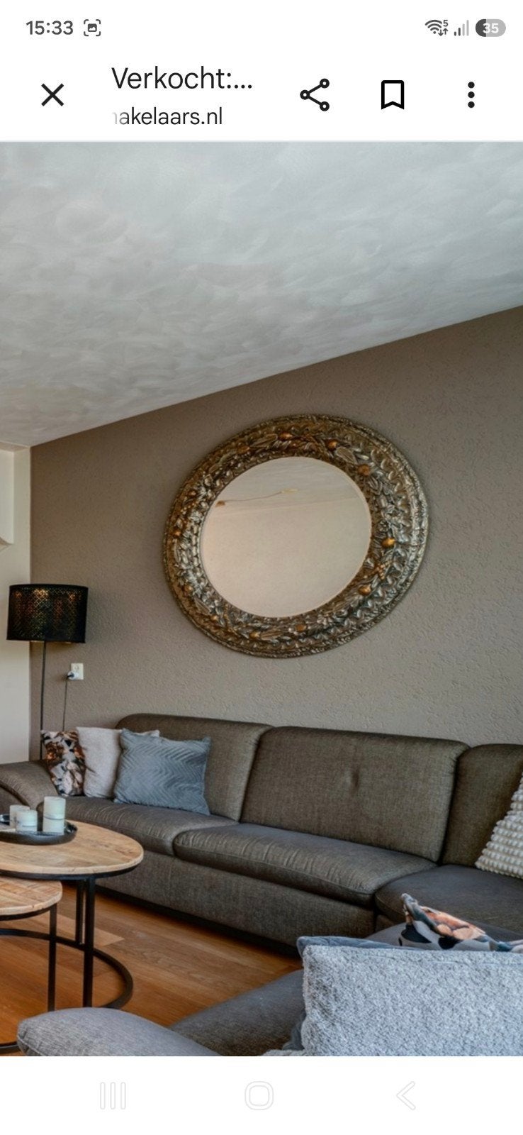 Decoratieve ronde spiegel met sierlijke lijst