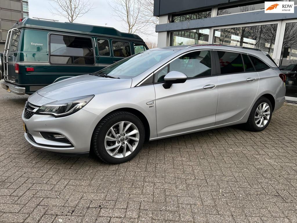 Opel Astra Sports Tourer 1.4 Turbo 120 Jaar Edition, Voorwielaandrijving, Stof, Gebruikt, Euro 6