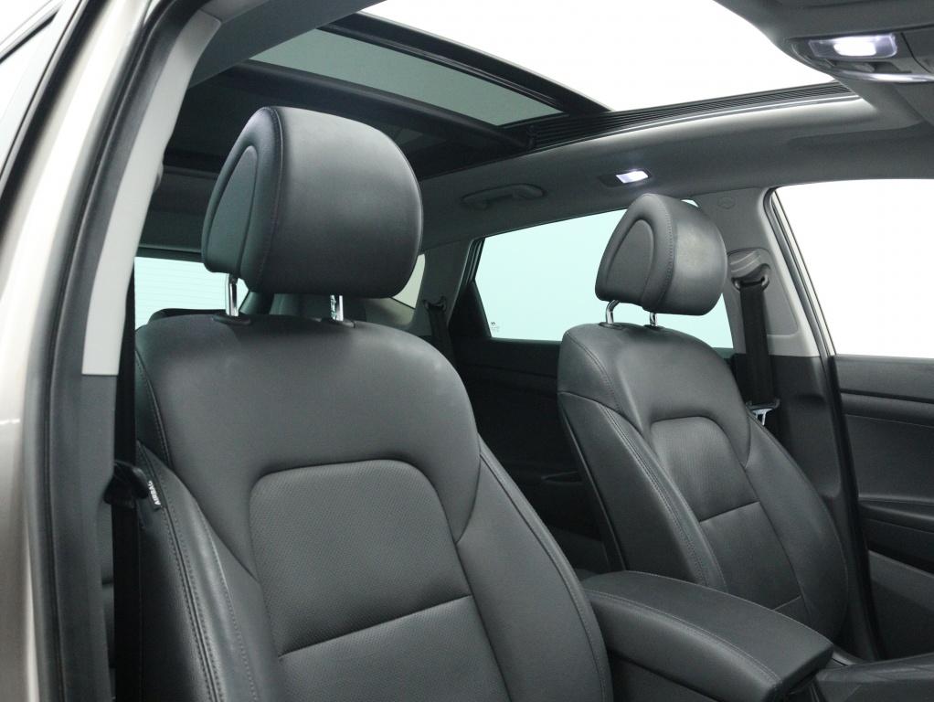 Hyundai Tucson 1.6 T-GDi premium Sky 4WD Automaat | Panodak, 12 maanden, Gebruikt, 4 cilinders, Wit