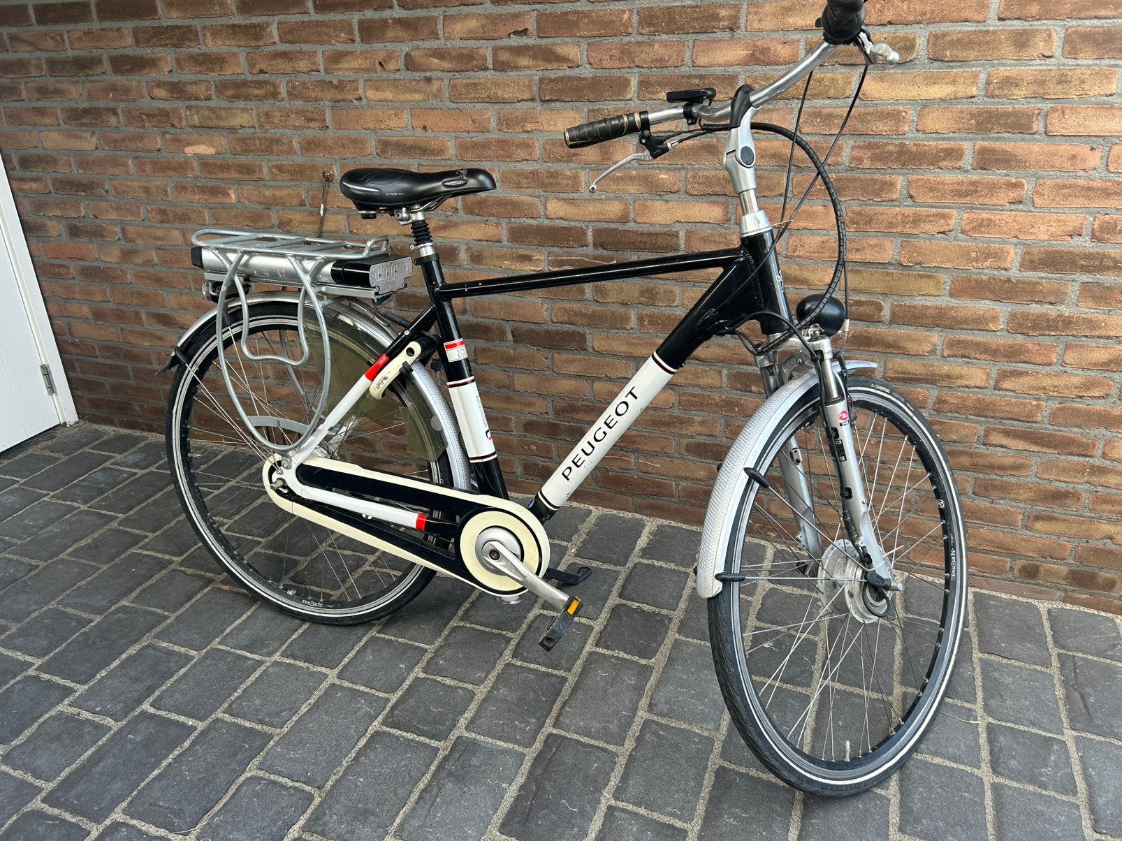 Electrische heren- en damesfiets Giant en Peugeot, Ophalen, Gebruikt, Minder dan 30 km per accu, Giant