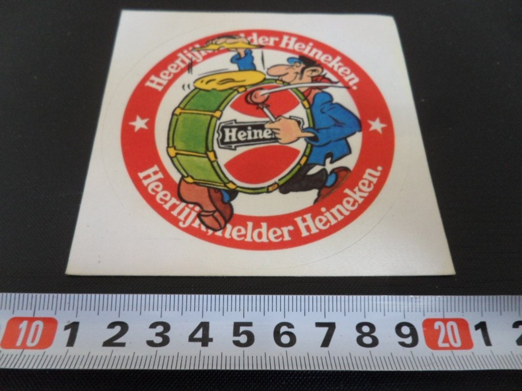 sticker Heerlijk Helder Heineken ( Jan van Haasteren ) Trom, Ophalen, Zo goed als nieuw