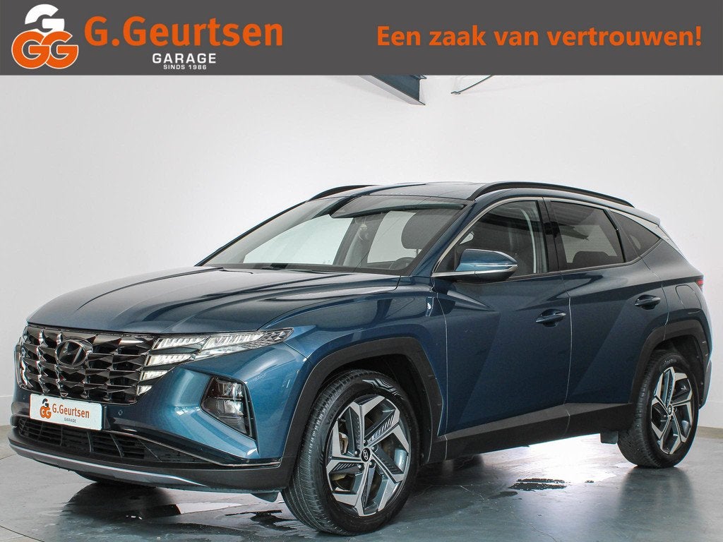 Hyundai Tucson 1.6 T-GDI HEV Premium Trekhaak, Volleder, Cam, Gebruikt, 4 cilinders, Blauw, 1650 kg