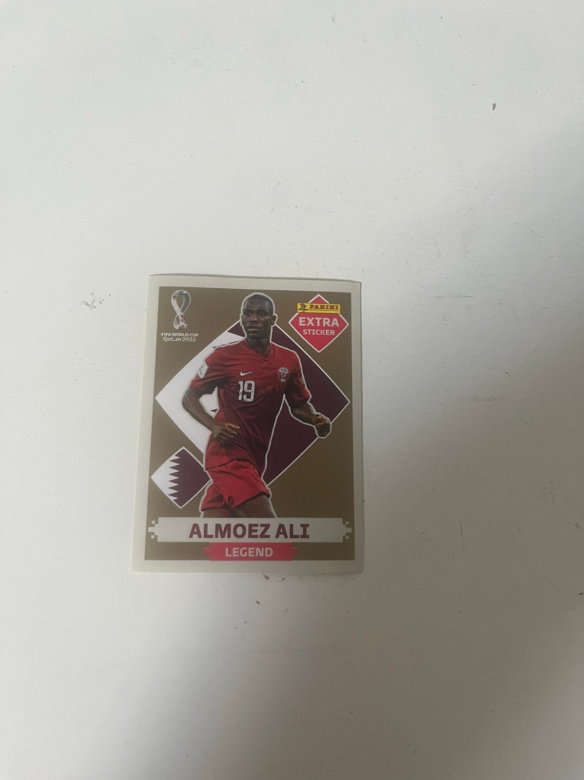 Panini WK 2022 Extra Sticker Almoez Ali Legend Goud, Ophalen of Verzenden, Zo goed als nieuw, Sport