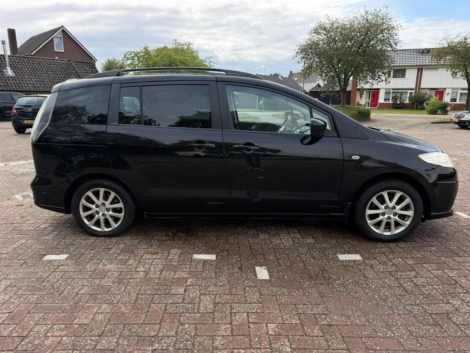 Mazda 5 2.0 2010 Zwart, Auto's, 145 pk, Zwart, 4 cilinders, 7 stoelen