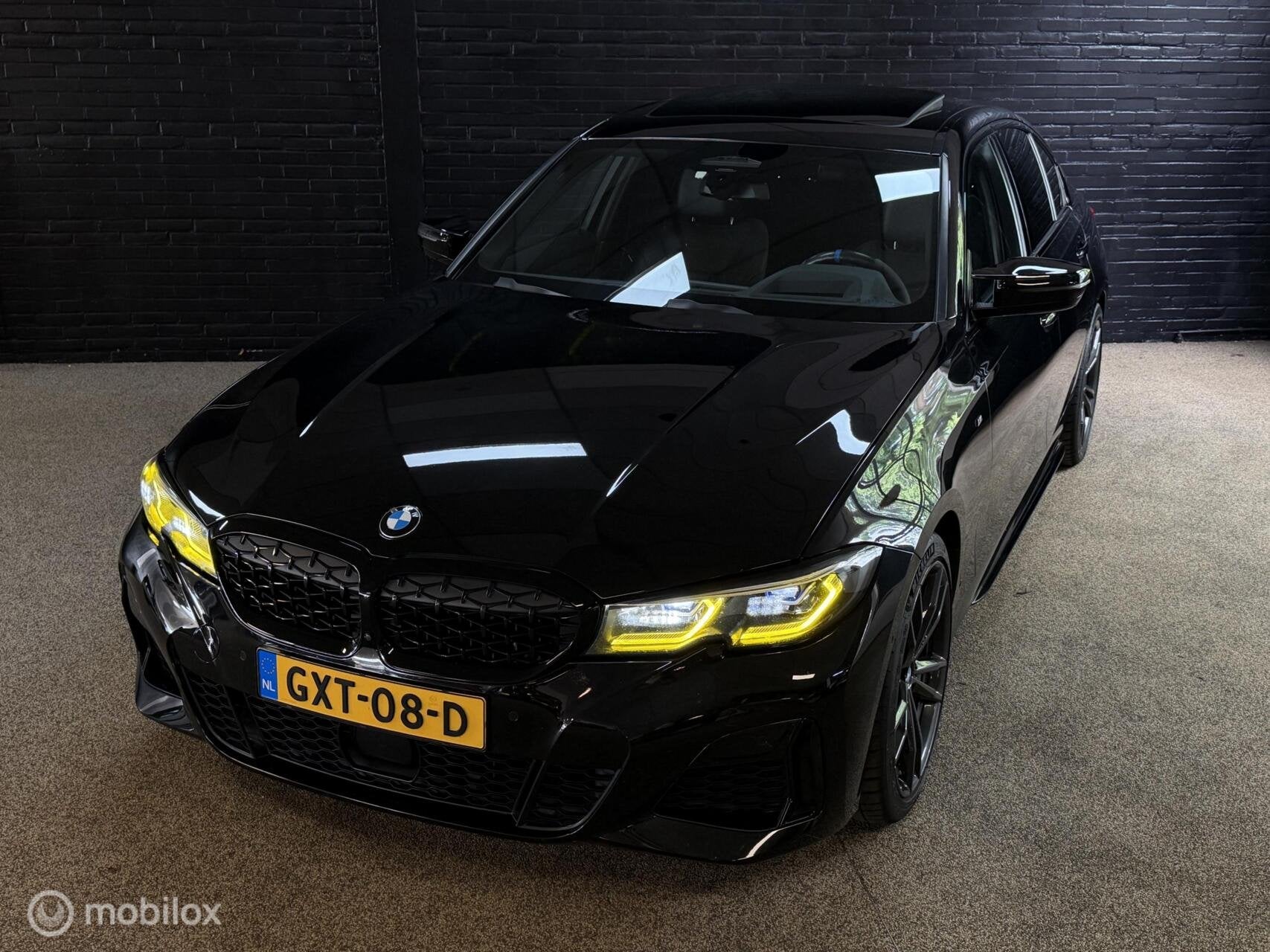 BMW 3-serie M340i xDrive High Executive LASER PANO HARMAN KA, Auto's, Zwart, Bedrijf, Vierwielaandrijving, Verwarmde buitenspiegels