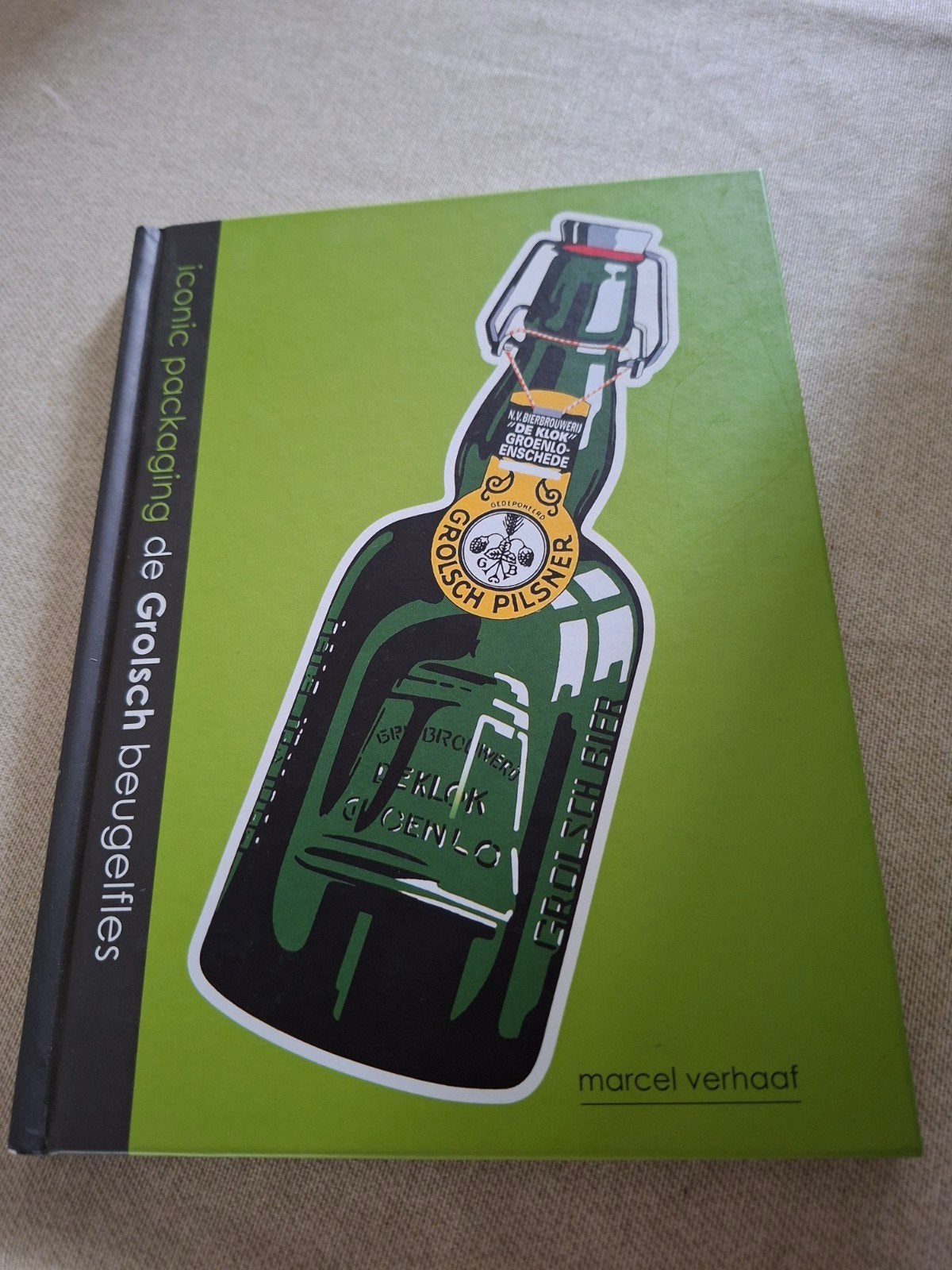 Marcel Verhaaf - De Grolsch beugelfles, Ophalen of Verzenden, Zo goed als nieuw, Overige typen, Grolsch