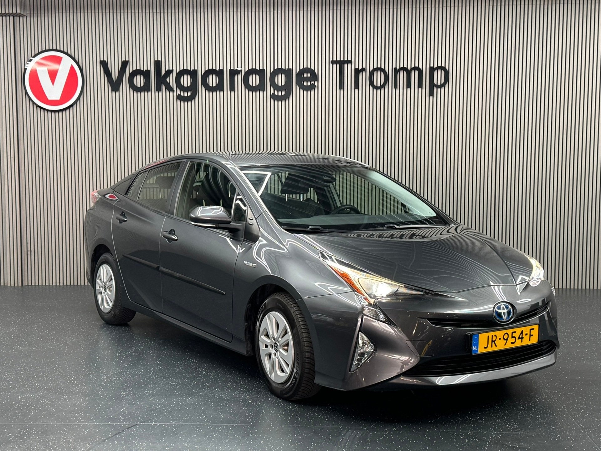 Toyota Prius 1.8 Aspiration, Stof, Met garantie (alle), Bedrijf, Hybride Elektrisch/Benzine