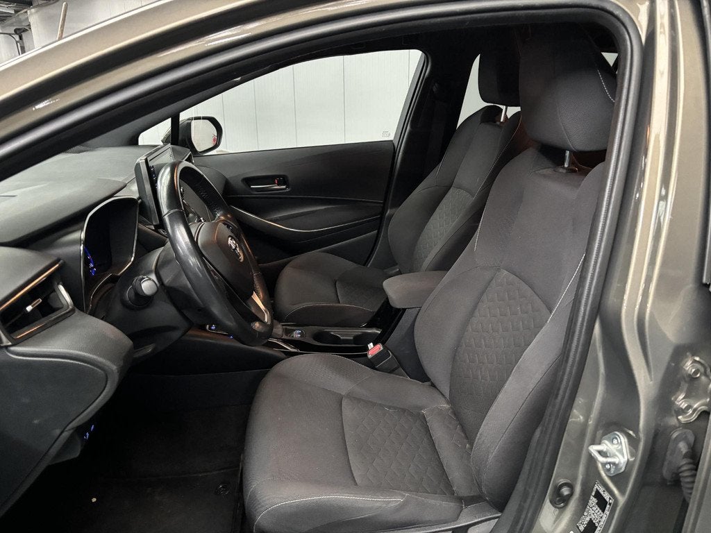 Toyota Corolla Touring Sports 1.8 Hybrid Business Plus, Auto's, Gebruikt, 4 cilinders, Corolla, 122 pk