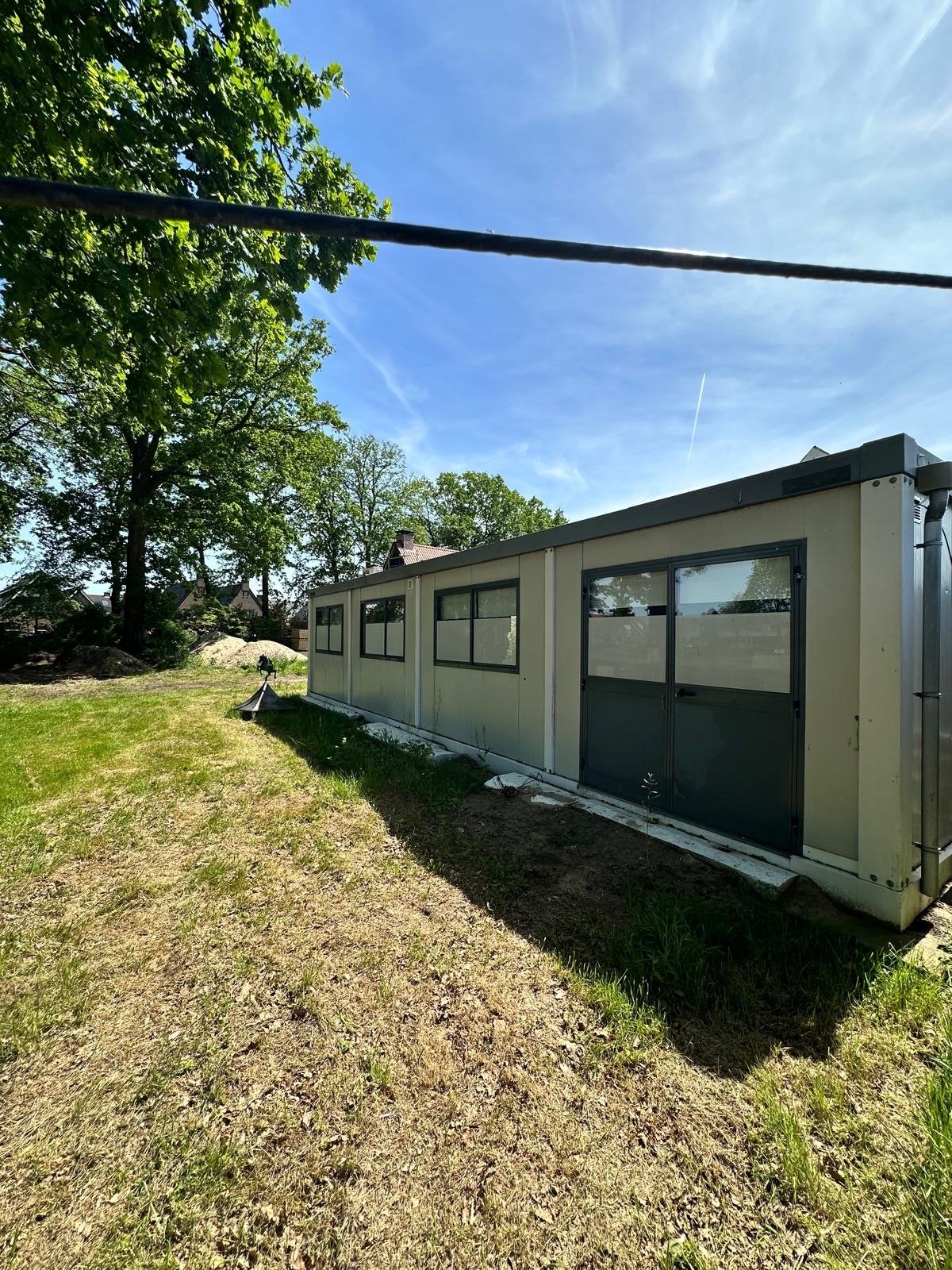 Goed onderhouden gasloze woonunit 3x12 meter (2 persoons), Zakelijke goederen, Machines en Bouw | Keten en Containers, Ophalen of Verzenden