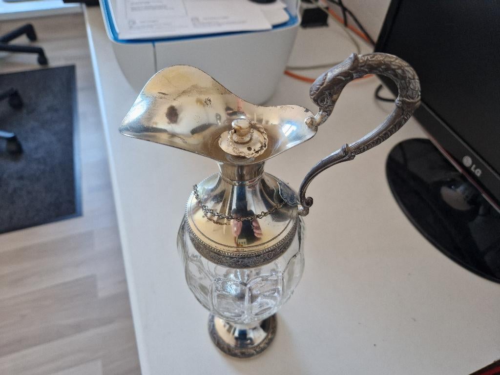 glazen karaf met zilver, Ophalen