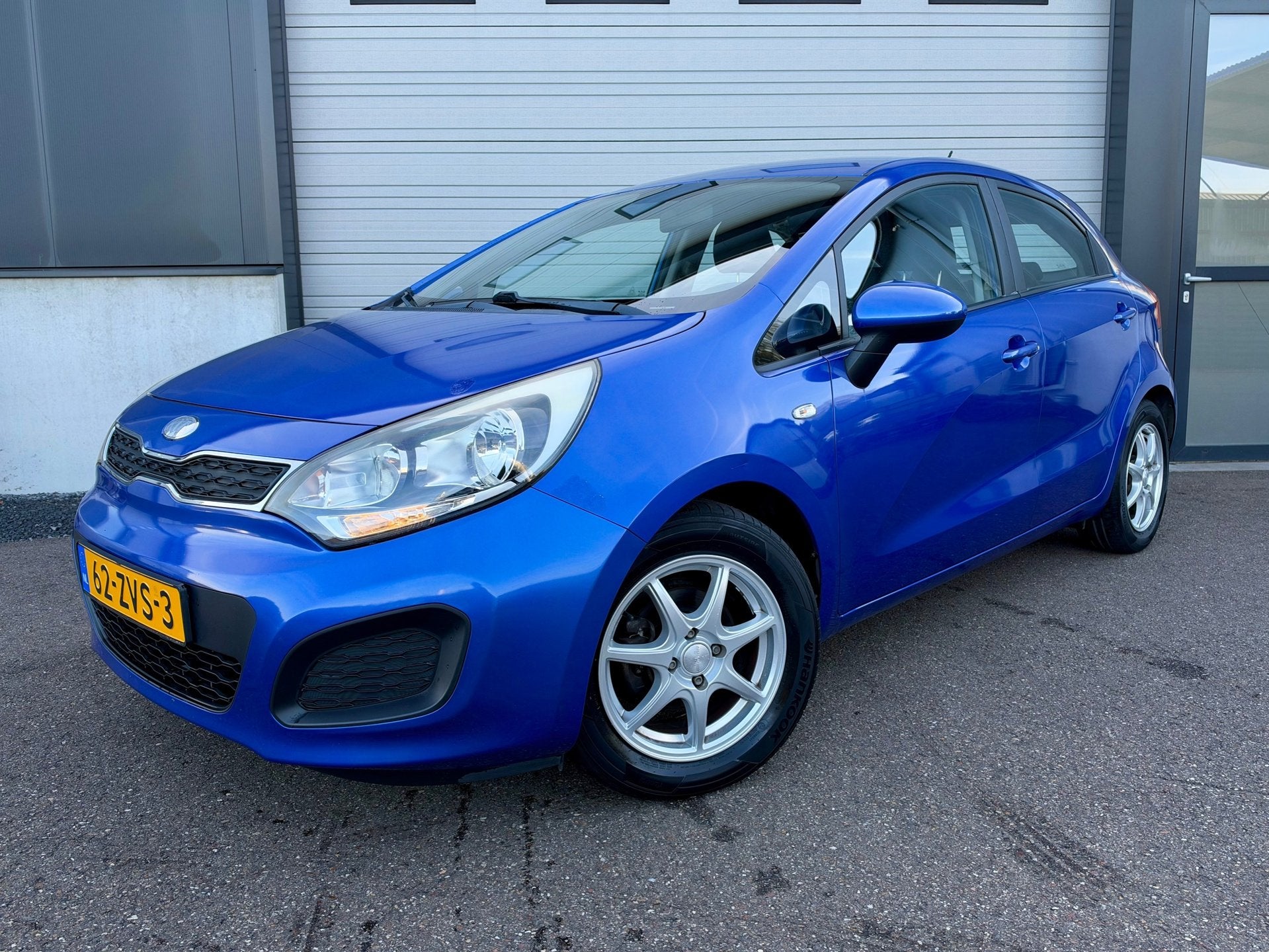 Kia Rio 1.2 CVVT Comfort Pack / 12mnd garantie / eerste eige, Auto's, Euro 5, Zwart, 4 cilinders, Blauw