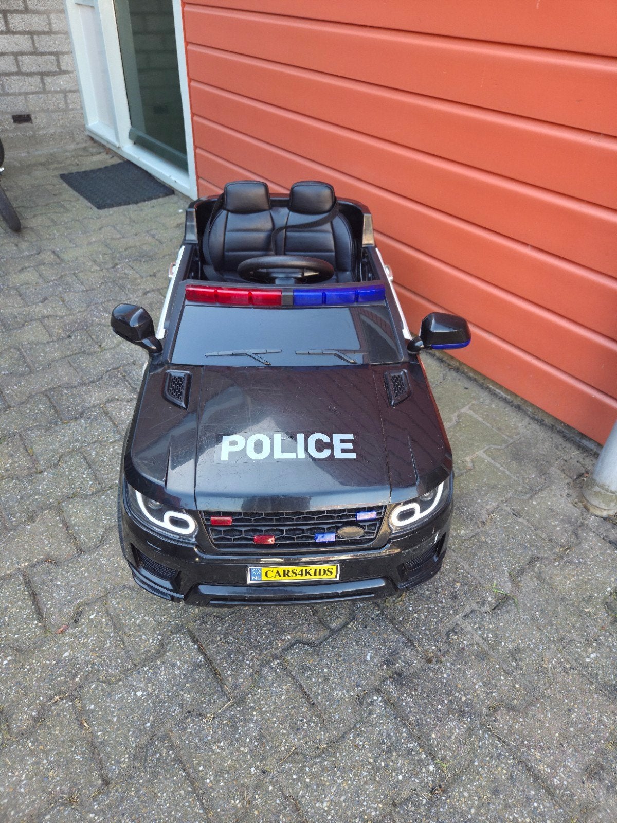 Elektrische kinder politieauto met afstandsbediening, Ophalen, Gebruikt