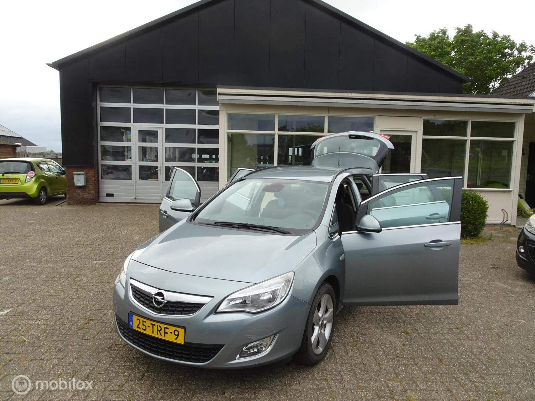 Opel Astra Sports Tourer 1.4 Turbo Edition, Auto's, Voorwielaandrijving, Euro 5, Stof, Gebruikt