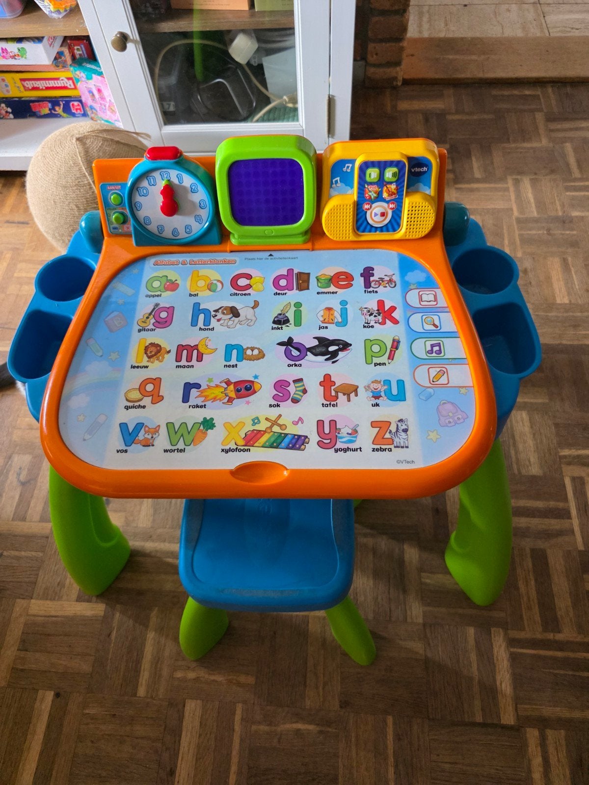 V-Tech speeltafel., Ophalen