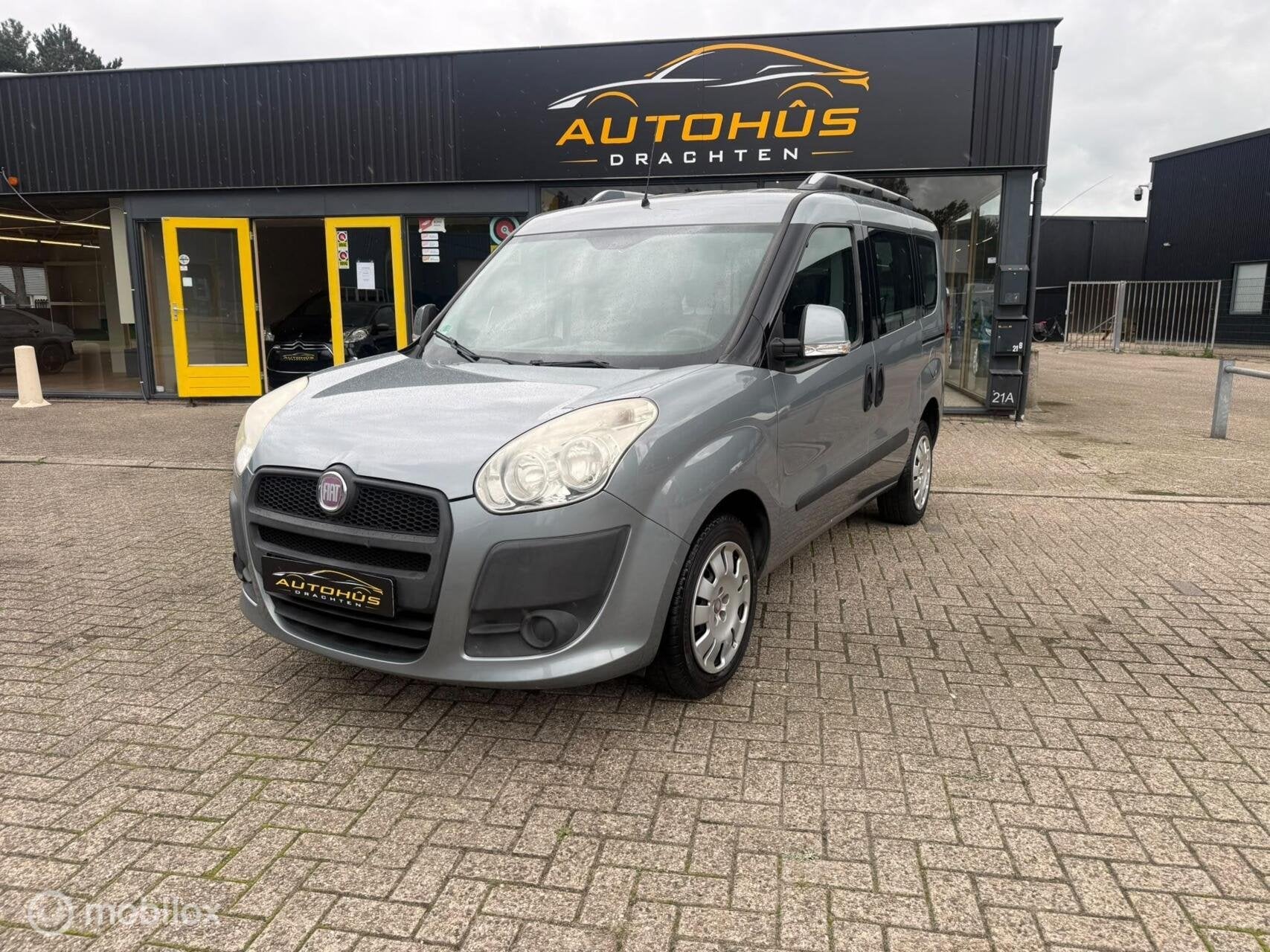 Fiat Doblo 1.4 Emotion 7p. AIRCO EL RAMEN TREKHAAK 120817 KM, Auto's, Voorwielaandrijving, Stof, Gebruikt, Blauw