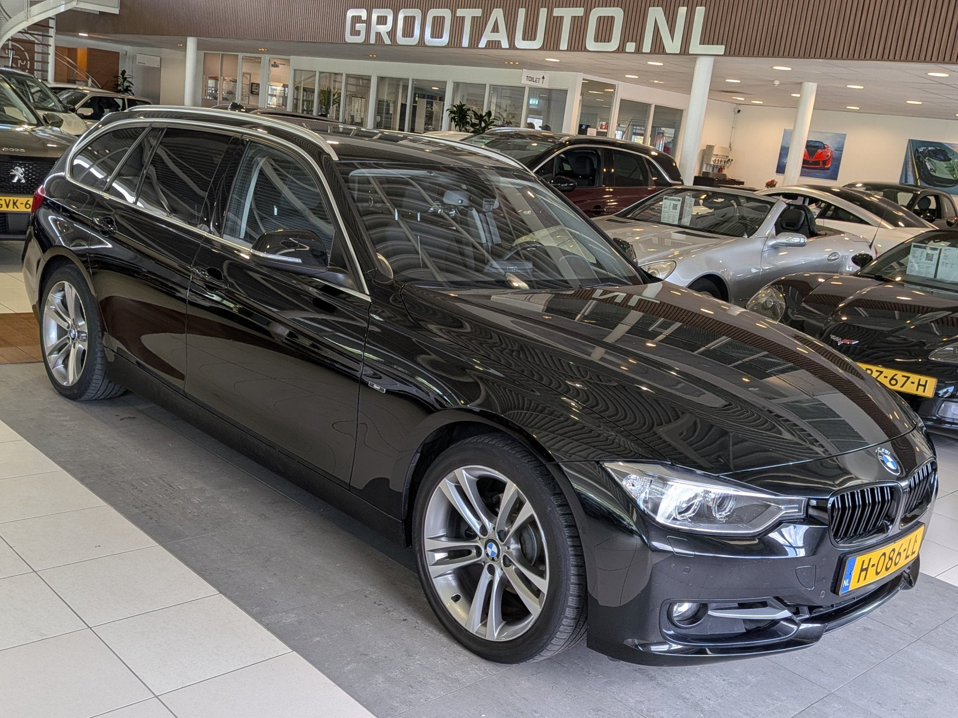 BMW 3 Serie Touring 320i High Executive Start/Stop Systeem,, Euro 6, 4 cilinders, Zwart, Handgeschakeld