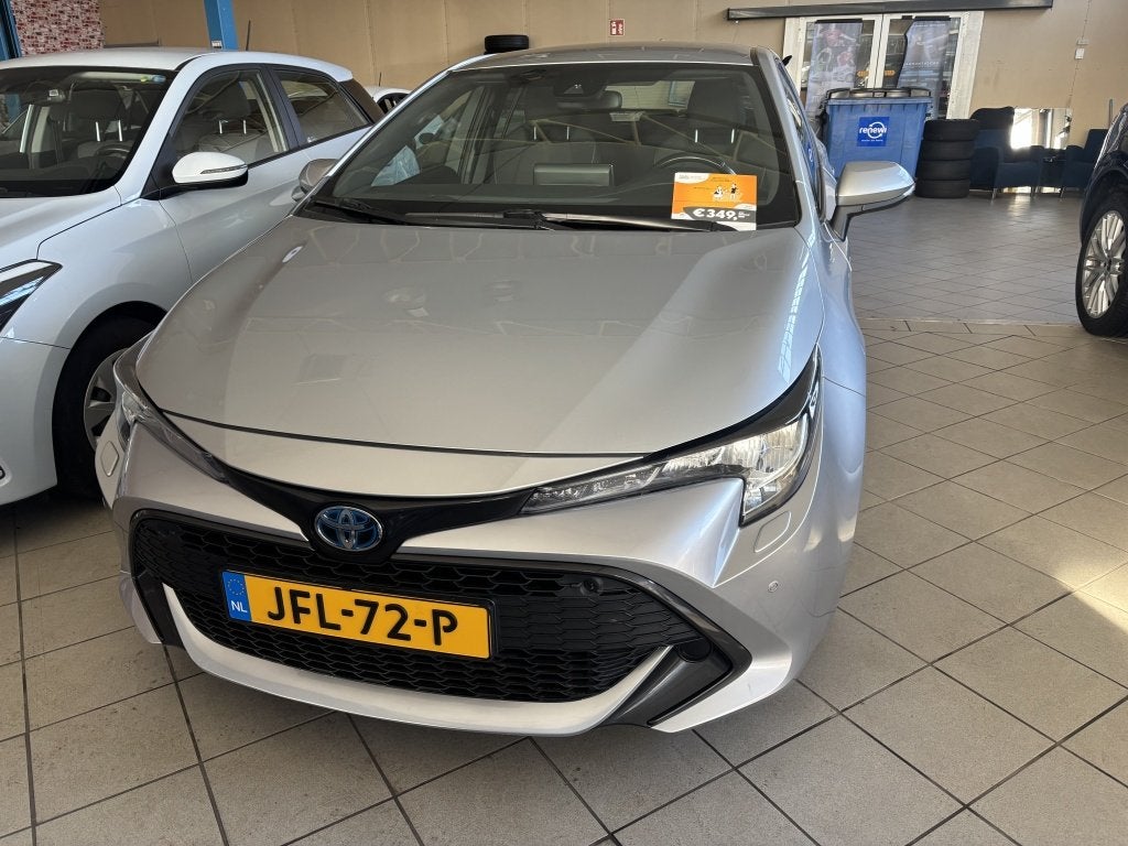 Toyota Corolla 1.8 Hybrid Active (bj 2022, automaat), Auto's, 450 kg, Gebruikt, 4 cilinders, Corolla