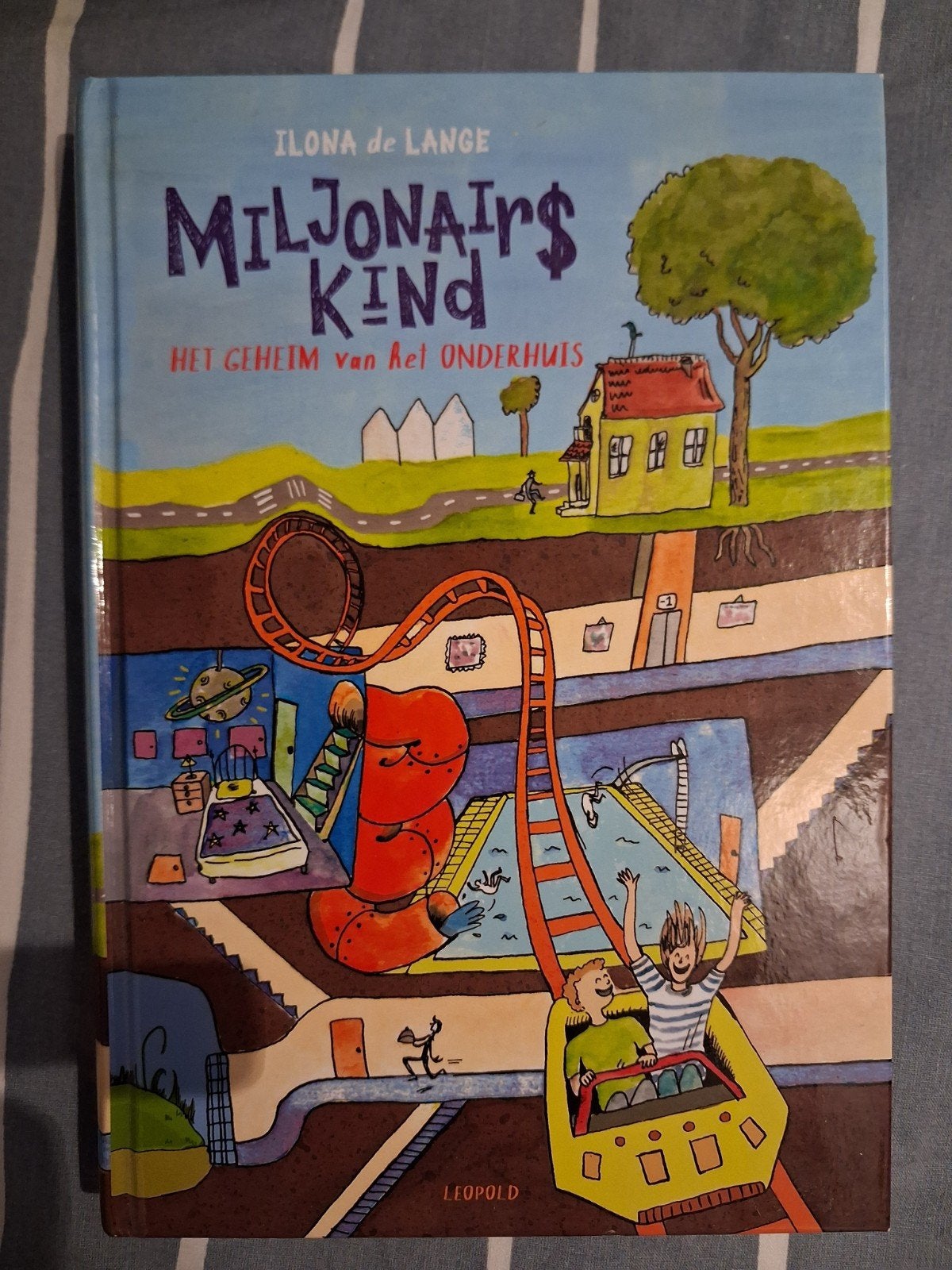 Miljonairskind:Het geheim van het onderhuis - Ilona de Lange, Boeken, Ophalen, Zo goed als nieuw, Ilona de Lange, Fictie
