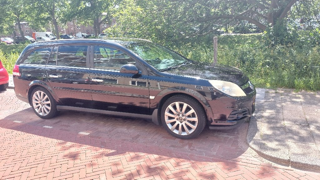 Opel Vectra 1.8 16V St.wgn 2009 Zwart, Auto's, Opel, Metallic lak, Zwart, 4 cilinders, 1796 cc