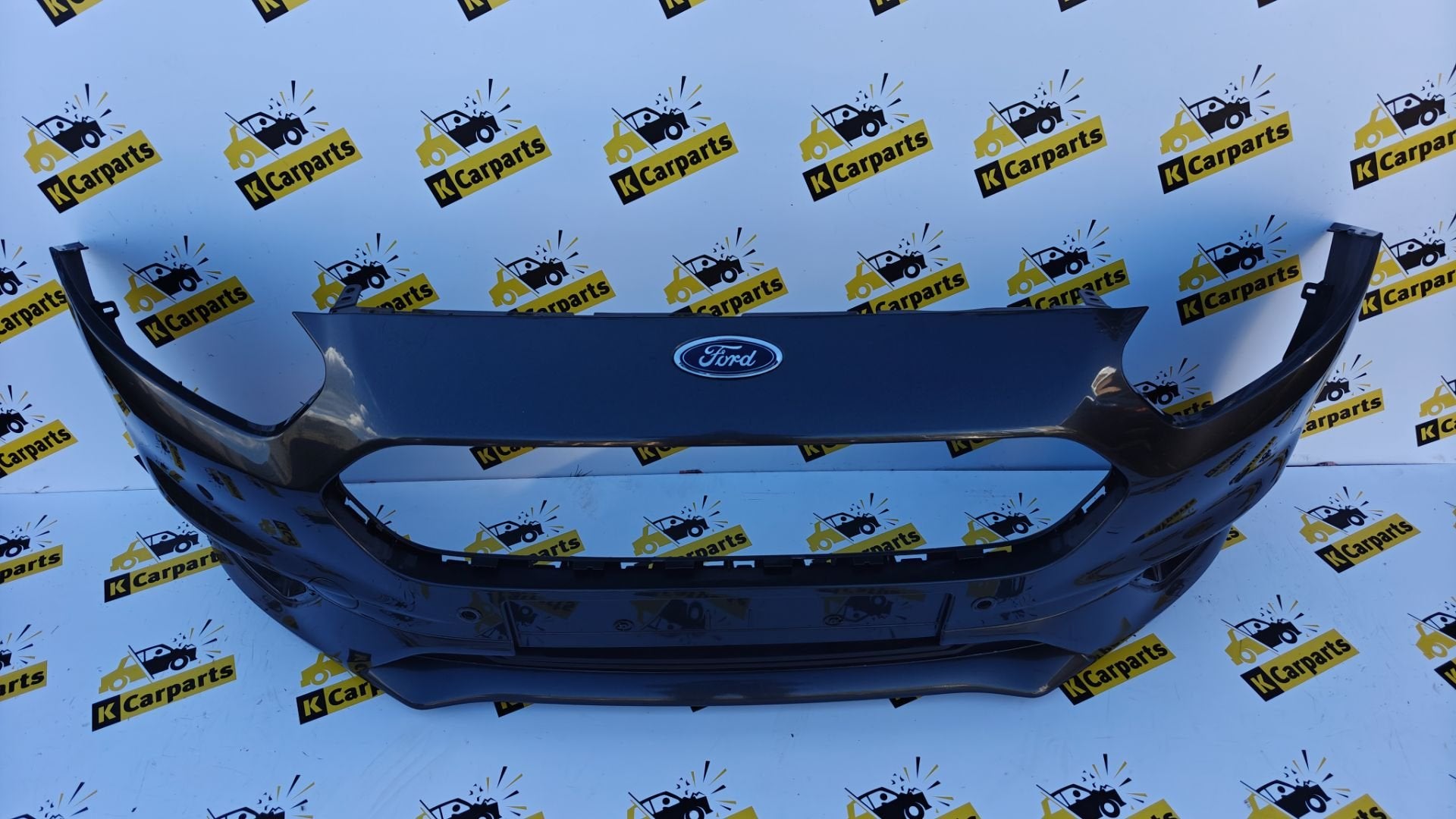 Voorbumper Ford Transit Courier FACELIFT JT76-17757-A, Gebruikt, Voor, Info@ford.com, Ophalen of Verzenden