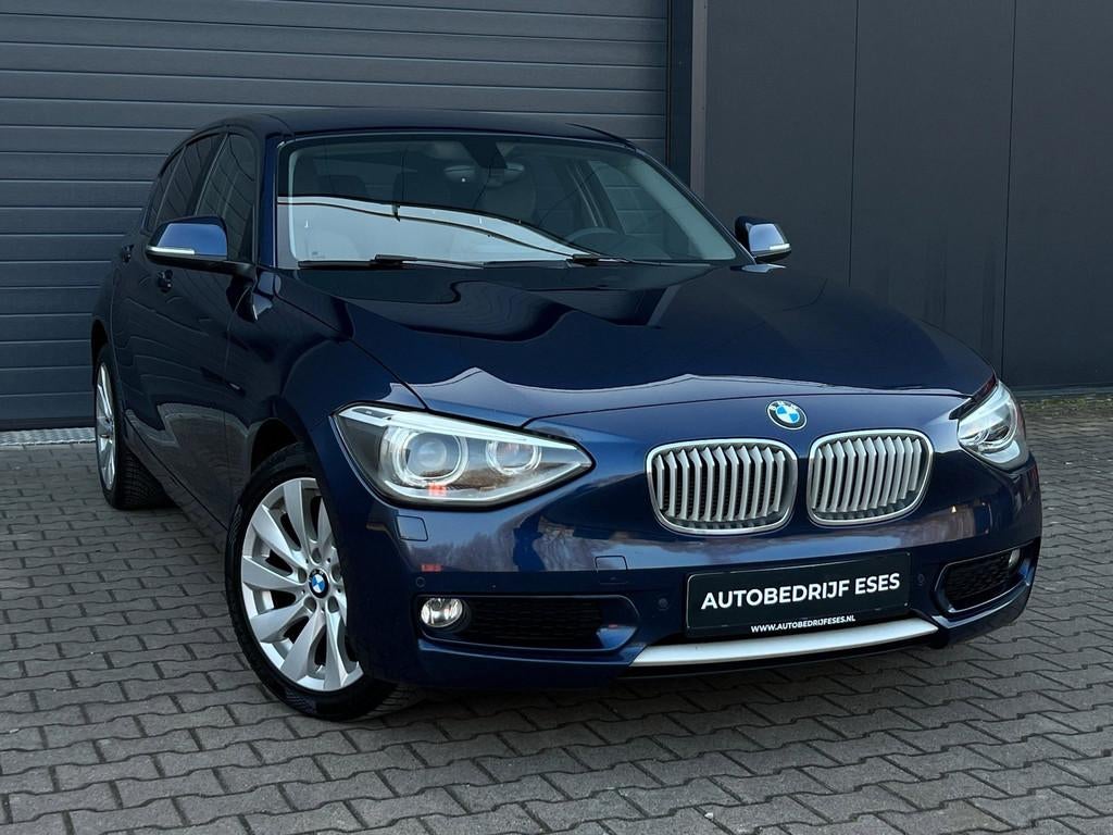 BMW 1-serie 116i Urban |MF-STUUR|CRUISE|CLIMATE|LEER|XENON, Auto's, Gebruikt, 4 cilinders, Met garantie (alle), Blauw