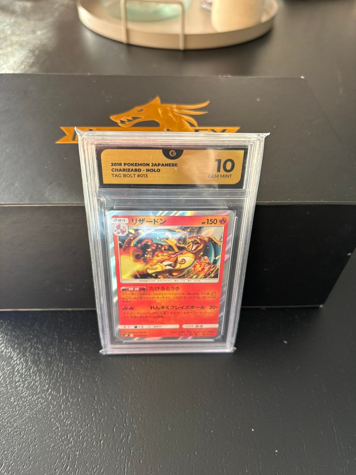 Charizard ex tag bolt, Ophalen of Verzenden, Zo goed als nieuw, Meerdere kaarten, Foil