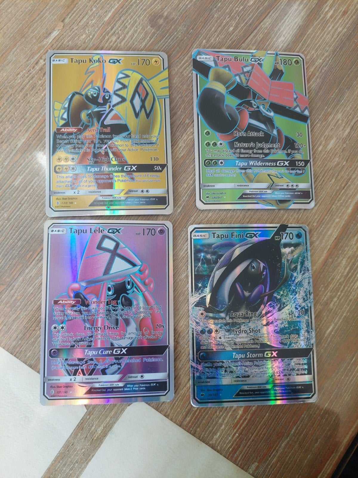 Pokémon Tapu Koko, Bulu, Lele GX (3x NM, 1x beschadigd), Ophalen of Verzenden, Gebruikt, Meerdere kaarten, Foil